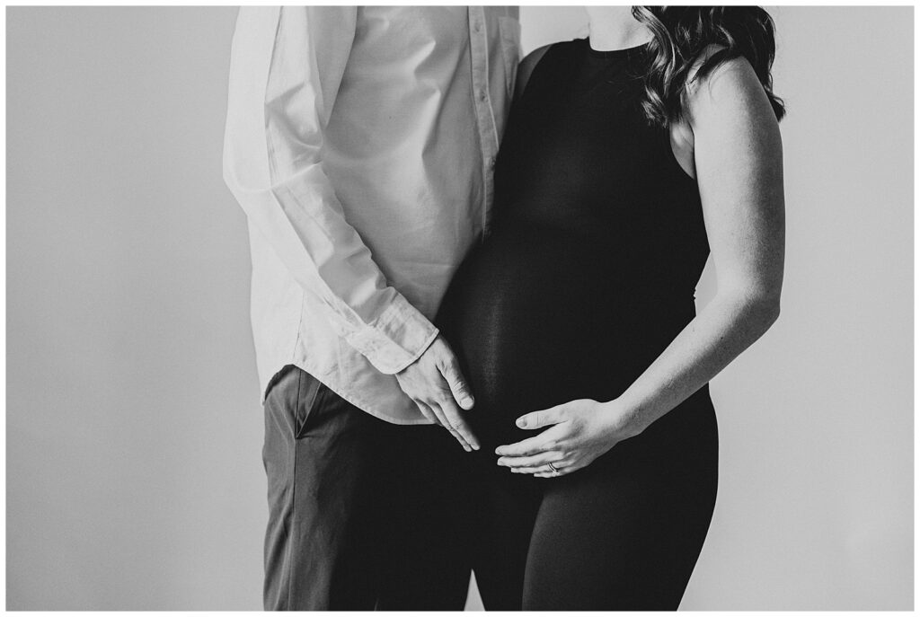 For Whitney + Alex's session at Rust & Honey studio in Fortville, Indiana, she wore a sleek black outfit to emphasize her bump and it gave the best modern vibes!