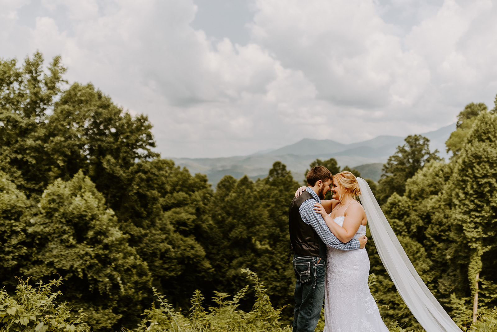 Savannah and Drew scratched their big wedding plans and chose to elope in the Smoky Mountains instead, getting their portraits done in front of these gorgeous mountains.
